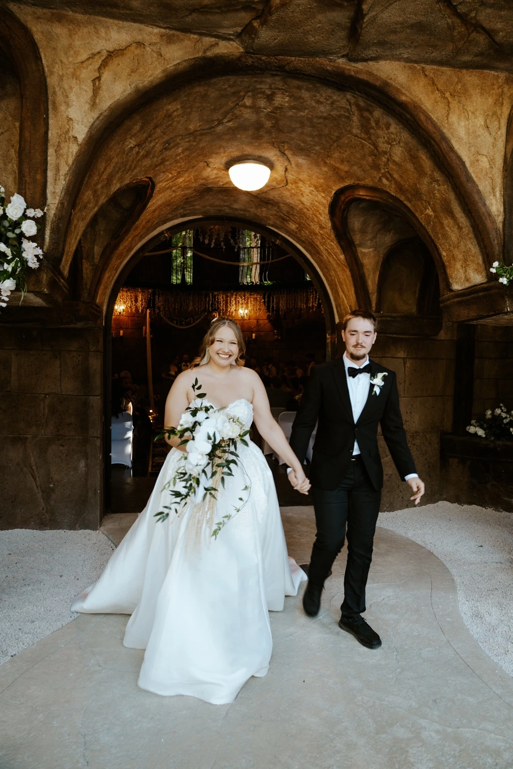 Newlyweds walking out of the chapel